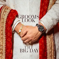 A detail-oriented shot focusing on the groom's look. This image highlights the texture of his white sherwani, his watch, and bracelet, capturing the small but significant elements of his wedding day style.