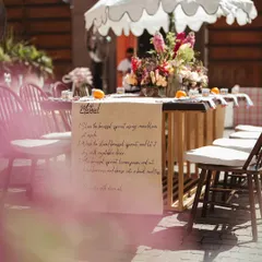 A unique table runner with a handwritten recipe, adding a deeply personal and creative touch to the tablescape at the Parisian Market Mehendi.