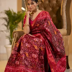 Capturing the elegance of traditional Indian attire requires a focus on detail and grace. This shot highlights the rich texture and intricate patterns of the saree, set in a luxurious indoor environment to convey a sense of timeless sophistication.