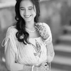 A beautiful black and white candid of the bride's natural, happy smile. It's these simple, genuine expressions that make the most beautiful portraits.