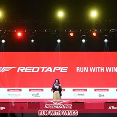 Your brand, front and center. This is the main stage at the RedTape 10K, where the brand's identity is the undeniable focal point. I ensure every visual element, from the largest screen to the smallest detail, reinforces your message with power and clarity.