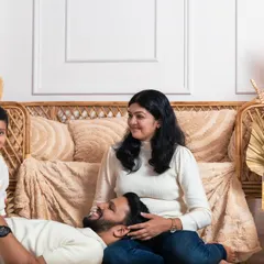 We encourage playful interactions during our sessions. Here, a candid moment of laughter is captured as dad lies on the floor, creating a memory that is both beautiful and authentic.
