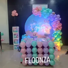 In addition to the backdrop, I can create matching decor elements like this balloon-covered table. It perfectly complements the pastel theme of the gender reveal party and provides a beautiful spot for the cake or gifts.