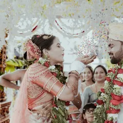 The 'jeerige bella' ritual, a playful and significant part of many South Indian weddings. I capture the laughter and tradition as the couple showers each other with a mix of cumin and jaggery.