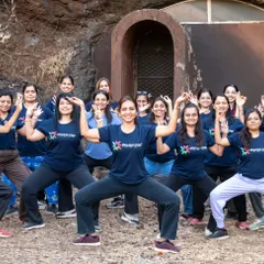 Our retreat participants embodying the energy of the divine feminine in Devi Asana. Practicing in nature amplifies the power and joy of the asana.
