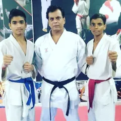 Two of my dedicated students standing with Hanshi Bharat Sharma. Moments like these provide invaluable inspiration and connect our academy to a rich lineage of martial arts tradition.