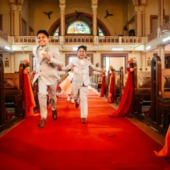 The page boys make a run for it down the church aisle! The pure, uncontainable energy of kids is always a joy to photograph.