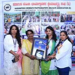 Receiving the award from the Karnataka Women's Photographer's Welfare Association. It's an honor to be recognized by my peers.
