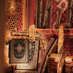 A corner of our recreated rug market for the Sufi sangeet. We sourced and layered dozens of carpets and rugs, rolling them and draping them to create the look and feel of a bustling Moroccan souk.