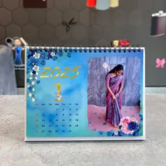 A still image of the blue floral themed desk calendar, showing the high-quality 300 GSM paper and sturdy white base stand.