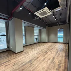 Here's another perspective on the open floor plan. It’s a versatile, blank canvas, fully air-conditioned and ready for you to set up for a yoga session, a high-energy Zumba class, or even a private birthday party. The possibilities are endless.