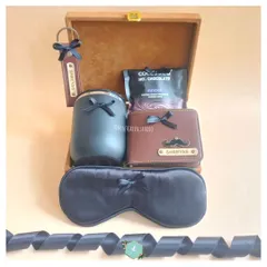 This hamper was a double celebration for a birthday and a dad-to-be. I included a personalized wallet and keychain, a travel tumbler, and a silk eye mask, all packed in a premium wooden box.