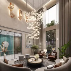 We bring nature indoors as an element of luxury in this double-height drawing room. A magnificent chandelier mimics a flock of birds in flight, complemented by large windows that flood the space with natural light, creating a seamless connection between the opulent interior and the lush exterior.
