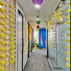 Even the office corridors are part of the celebration. I used hanging flower strings and paper lanterns to brighten up the passageway for Diwali.