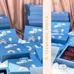 Announce your little one's arrival with this treasure trove of joyous tidings. These whimsical, sky-themed boxes are filled with sweet treats to share the happy news with friends and family.