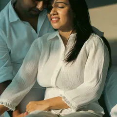 The warmth of sunlight on her face as they share a quiet moment. Our studio is designed to make the most of natural light for soft and emotive portraits.