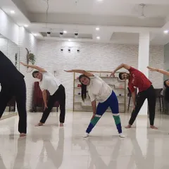 This is from one of my group yoga classes at The Marun Dance Studio in Dwarka. I'm guiding my students through a side-stretching sequence to improve flexibility and release tension.