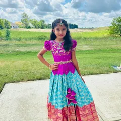 The same beautiful client enjoying the outdoors in her Banarasi pattu lehenga. The rich colors and traditional silk fabric make it perfect for both indoor and outdoor celebrations.