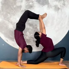 Partner yoga is about trust, balance, and creating beautiful shapes together. This Acro Yoga pose showcases the strength and connection we build in our community.