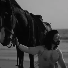 An extensive editorial series of a male model with a horse on the beach. I used a mix of color and black and white, along with varied poses, to create a powerful narrative of untamed strength and freedom.