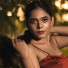 A close-up portrait from our golden hour shoot. The soft, warm light and the bokeh in the background come together to create a really magical, film-like quality.