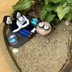Here you can see the details of the couple figurine, the tiny slippers, and the tender coconuts I made for this beach garden. Every element is crafted by hand.