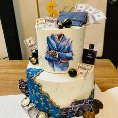 For those who appreciate the finer things, this two-tier luxury themed cake is a perfect choice. It's a multi-layered experience with flavors like couverture chocolate with salted caramel, Nutella hazelnut, and strawberry compote, all coming together for an unforgettable taste.