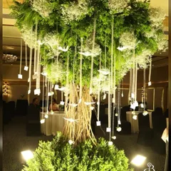 Instead of a typical stage, we brought this magnificent "Wish Tree" to life for Akhil and Zoee's reception. We built the tree from scratch using dry twigs and adorned it with baby's breath, crystals, and custom wish cards for a truly interactive and enchanting centerpiece.