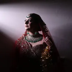 A dramatic, artistic shot of my bride Kaveri. The lighting highlights the sharp contour and the perfect winged liner, creating a powerful and memorable bridal portrait.