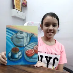 Tanisha, a 7th grader, with her acrylic on canvas still life painting. Working with different mediums like acrylics helps students understand colour and form more deeply.
