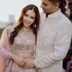 A sweet moment from Shazahn Padamsee and Ashish's intimate roka ceremony. Their gentle embrace and happy smiles perfectly capture the excitement and promise of a new beginning.