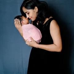 A mother's gentle love. This tender moment between a mom and her newborn is what family photography is all about.