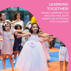 Learning together is always more fun. This image shows a group of children joyfully participating in a guided dance or movement activity.