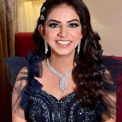 My beautiful bride Aditi for her engagement. Her smile says it all. The sparkly blue smokey eye perfectly complements her navy blue gown.