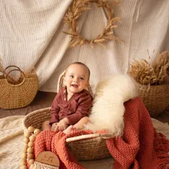 The pure joy of a sitter session. This baby boy's happy laugh is infectious in this warm, rustic setup.