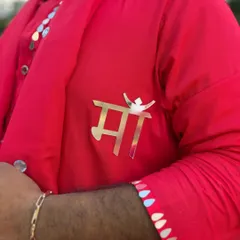 A close-up of my custom 'Maa' brooch. I often add personal touches to my outfits that hold special meaning, like this tribute to my mother.