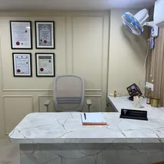 A closer look at the consultation desk in my prior clinic. My qualifications were always displayed to assure patients of my expertise and training.