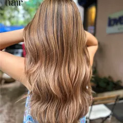 A beautiful burnished bronde. This look is the perfect mix of blonde and brown, with heavy highlights creating a bright, high-contrast, and dimensional result.