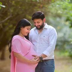 A close-up shot focusing on the connection between the parents-to-be and their baby bump. These intimate portraits are a beautiful way to remember the feeling of waiting to meet your little one.