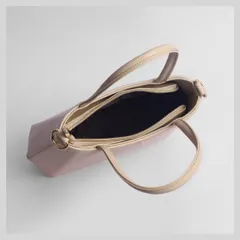 An overhead shot looking into the bag, revealing the compartments and lining. This is a crucial shot for functionality.