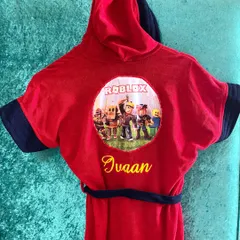 Make bath time fun with our personalised kids' bathrobes. This red one features a Roblox theme and can be embroidered with your child's name.