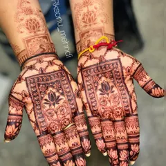 A gorgeous, dark stain on a traditional bridal design. The details of the lotuses, peacocks, and geometric patterns are still perfectly clear, showing the quality of the art and the paste.