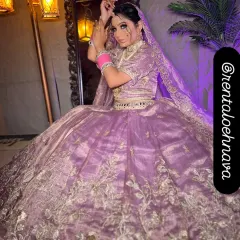 For the modern bride, I offer pastel options like this beautiful lilac organza lehenga. It's detailed with delicate silver floral embroidery, ideal for a day wedding or Anand Karaj ceremony.