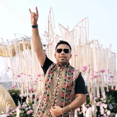 Rocking a semi-traditional look in front of a beautiful floral wedding mandap. This embroidered jacket is perfect for a modern yet ethnic celebration.