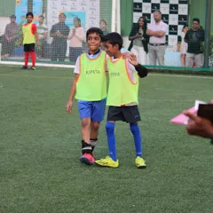 Football teaches sportsmanship and friendship. Here are two teammates sharing a moment of camaraderie during a break in the game.