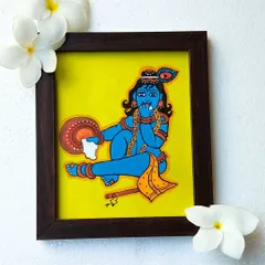 This painting shows Navanita Krishna, the butter dancer, in a joyful pose. The 9x10 inch framed piece is styled with fresh flowers to highlight its simple beauty and charm.