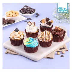 An assortment of our gourmet cupcakes, perfect for any celebration. This selection includes flavors like Oreo, Kit Kat, and Nutella, alongside our colorful rainbow sprinkle cupcake. There's something for everyone.