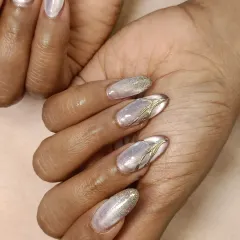A detailed shot of my cat-eye, glitter, and chrome combination. You can see how the different textures work together to create a luxurious and eye-catching manicure.