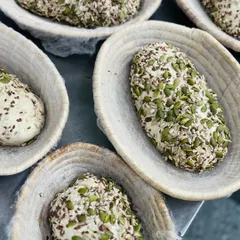 Our seeded bread dough resting in banneton baskets before baking. This shows the traditional, artisanal process we use to create our signature loaves.