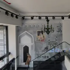 For Puma's store in Himayatnagar, Hyderabad, we created a mural that blends the city's iconic Nizam-era architecture with the brand's fierce identity. The result is a striking piece where street art meets streetwear, featuring the Charminar alongside the iconic puma.
